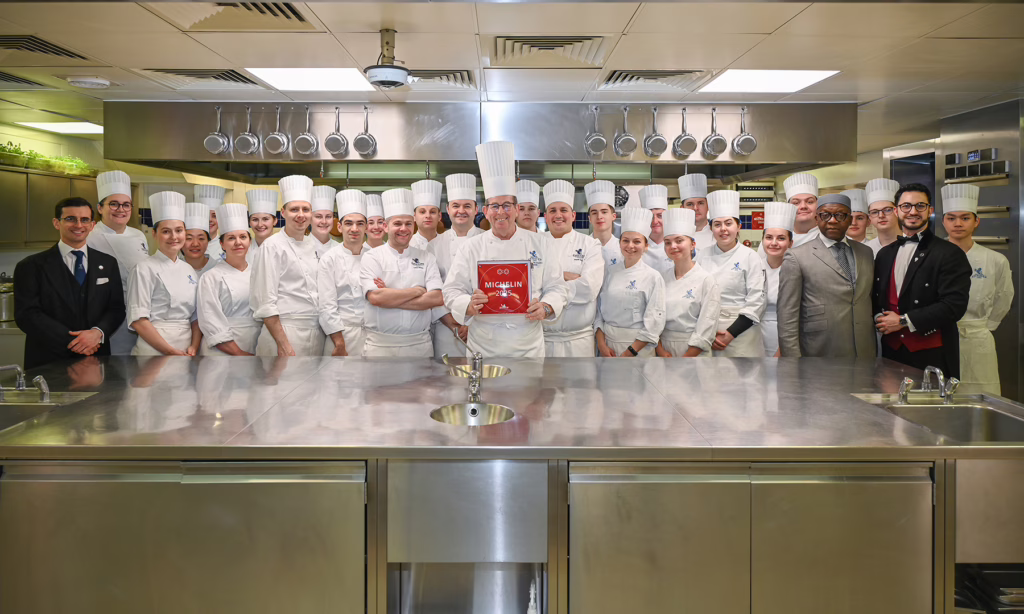 2025 Two Michelin Star plaque being delivered to The Ritz Kitchen team
